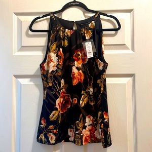 Elegant sleeveless black flower print blouse. Never worn, still with tags.